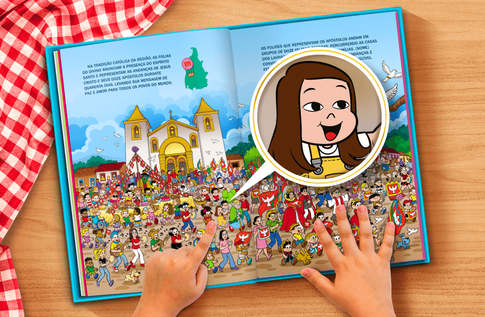 Foto de uma criança com seu livro personalizado da Turma da Mônica - Festas Populares